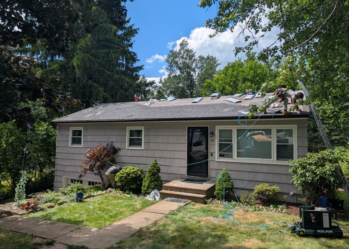 Tri-Valley Contracting crew installing shingles on a home in Wingdale, NY